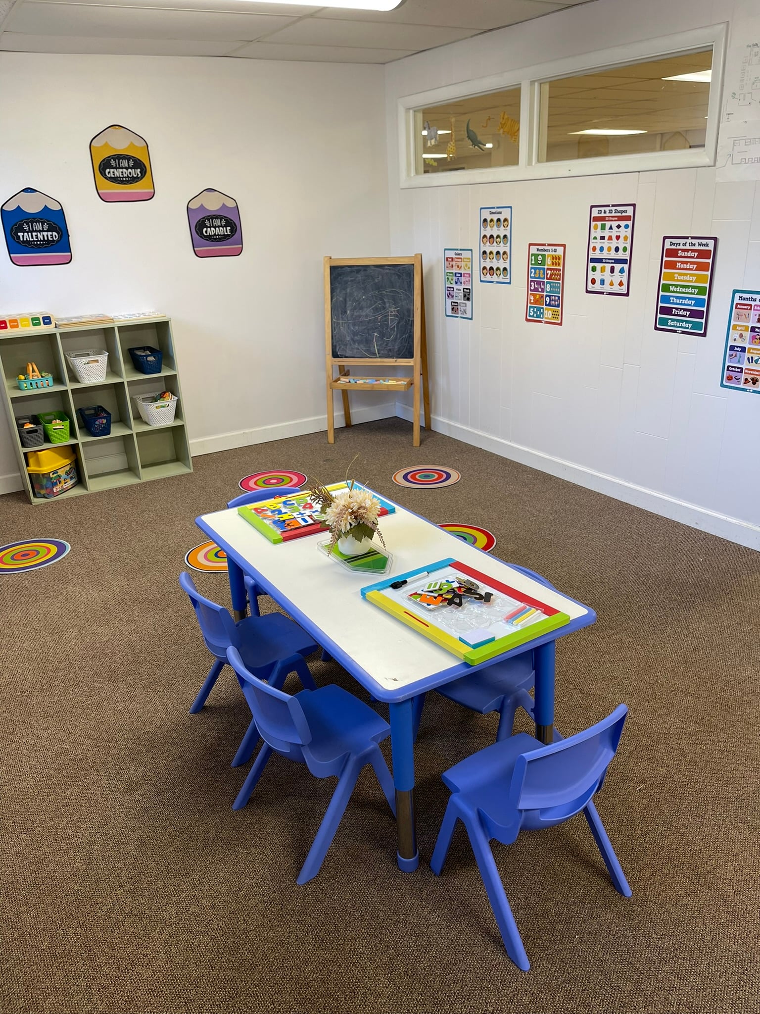 Classroom with a blue activity desk