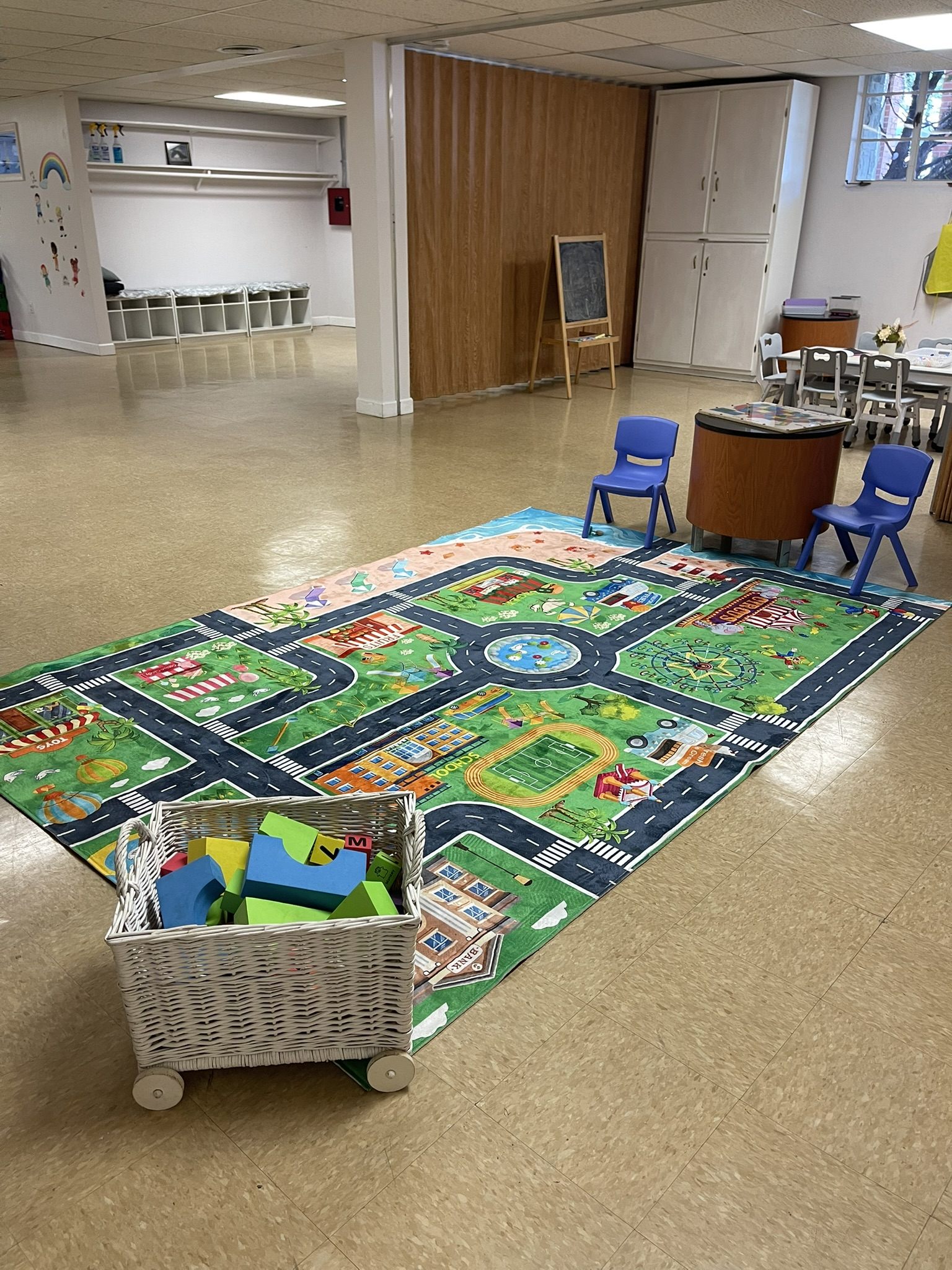 Play area with a racetrack rug